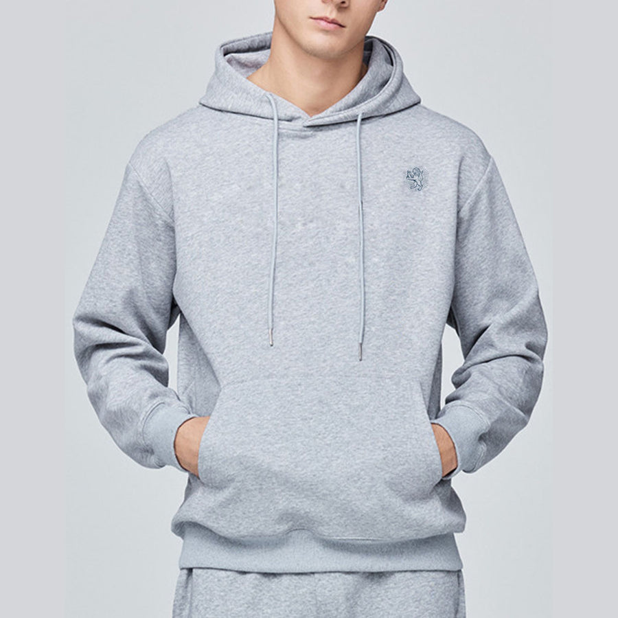 Person wearing a gray hoodie on a light gray background